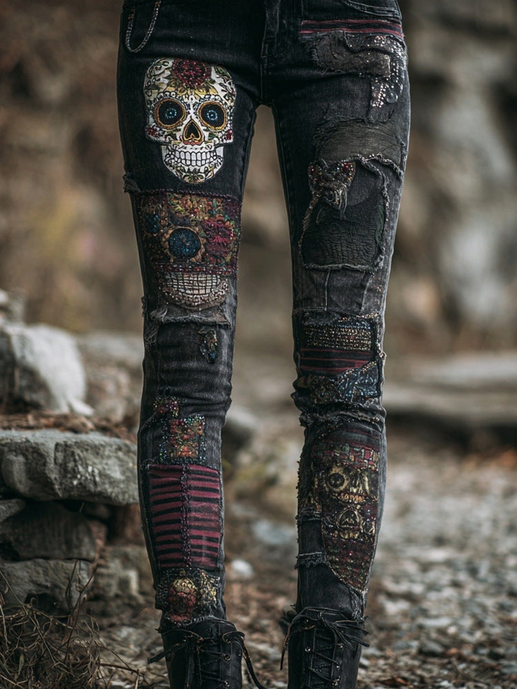 Distressed jeans with a colorful skull design on a rocky background
